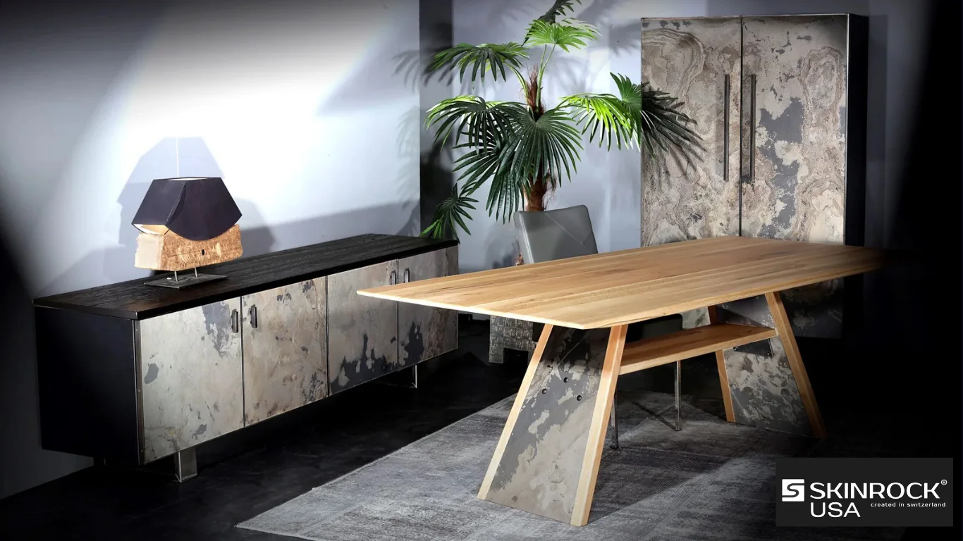 Stone-faced cabinet doors and table supports paired with warm timber in a dining setting