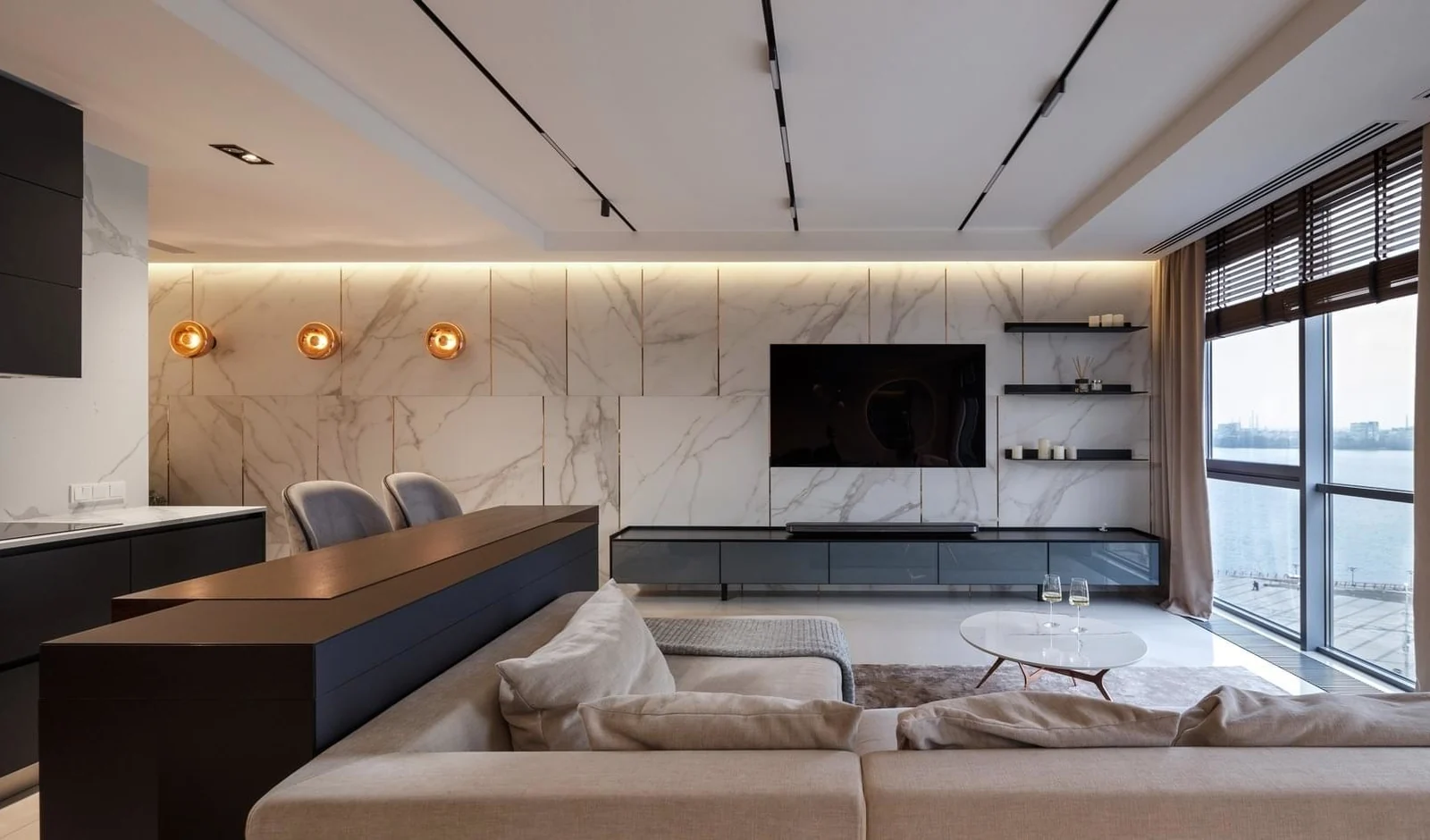 Living room centered around a softly veined natural stone feature wall