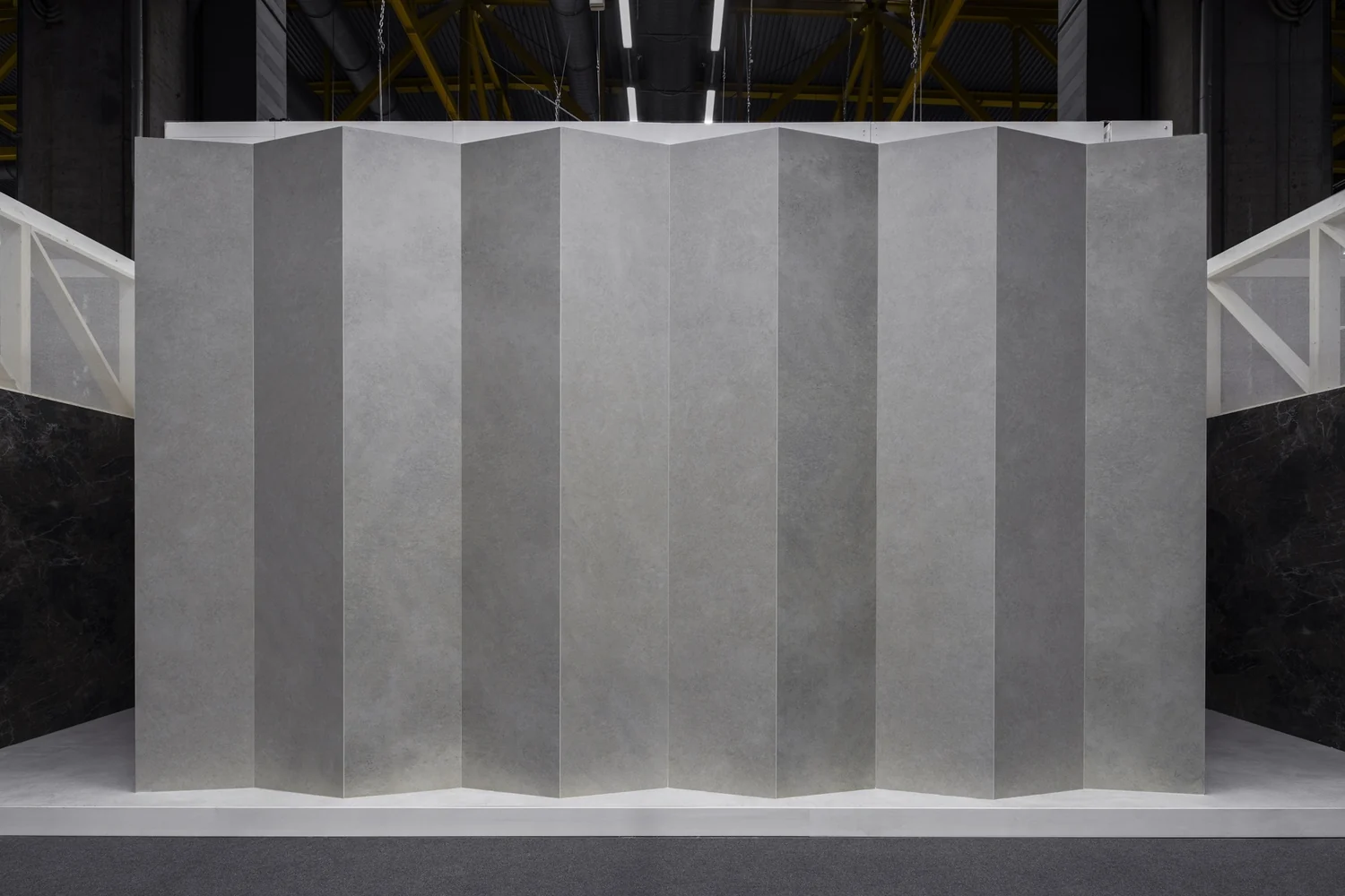 Thin architectural panels folded into a precise faceted form
